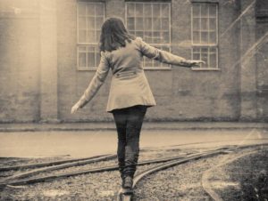 girl walking on the railway, retro stylized photo