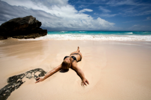 Woman Laying on Beach